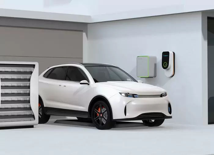 white-car-charging-in-garage